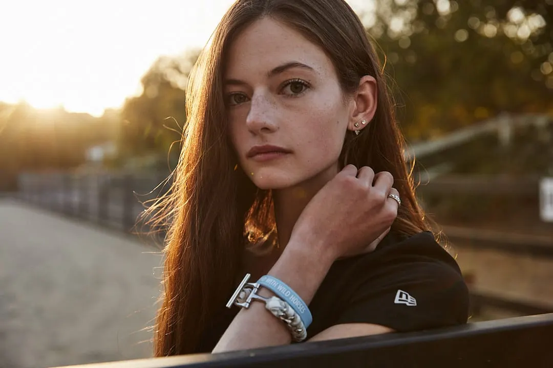 Mackenzie Foy wearing an 'I Stand With Wild Horses' bracelet